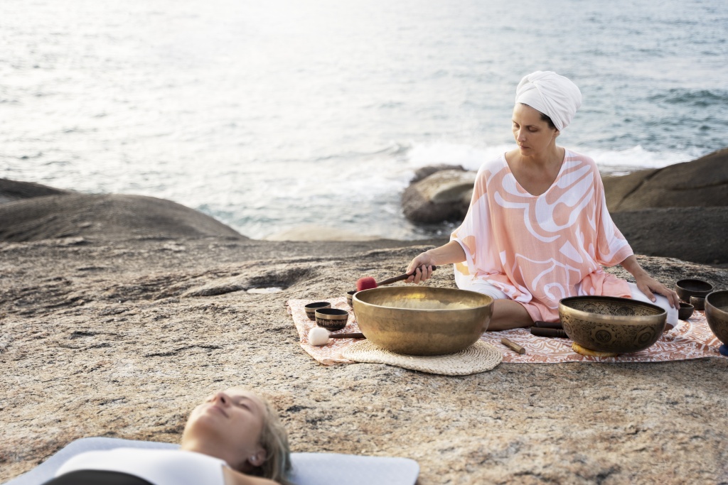 senior-meditation-guide-with-singing-bowls.jpg